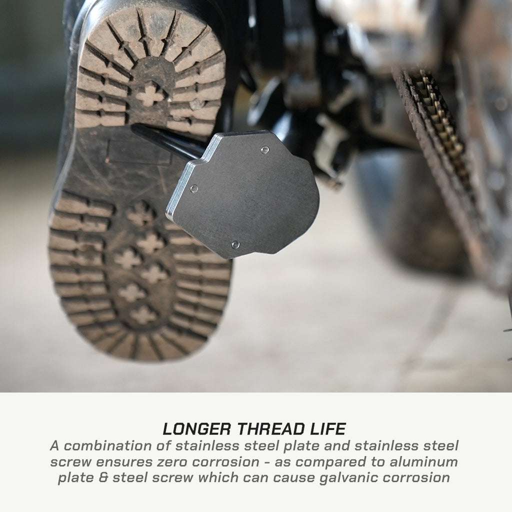 Close-up of a motorcycle step-through plate mounted over a treaded boot sole, with text below explaining longer thread life and corrosion resistance.