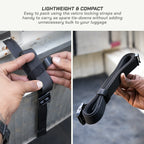 Black velcro locking strap being used to secure a package to a vehicle, with text highlighting its lightweight and compact nature.
