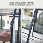 Black strap with a clip held by a hand, attached to a vehicle window, with text about maintaining tension during vibration.