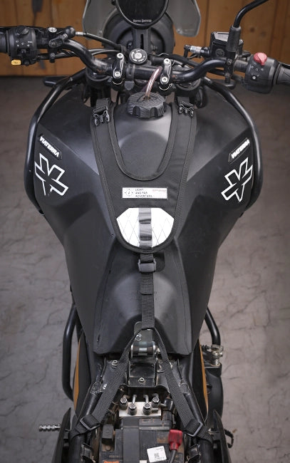 Dual Frame Anchoring Close-up of a motorcycle's front section with visible branding on a gray background
