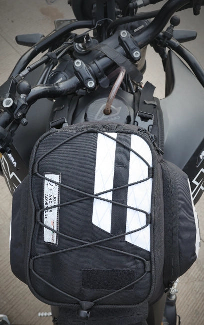 Ergonomic Tapered Profile Black motorcycle saddlebag with white stripe on a motorcycle