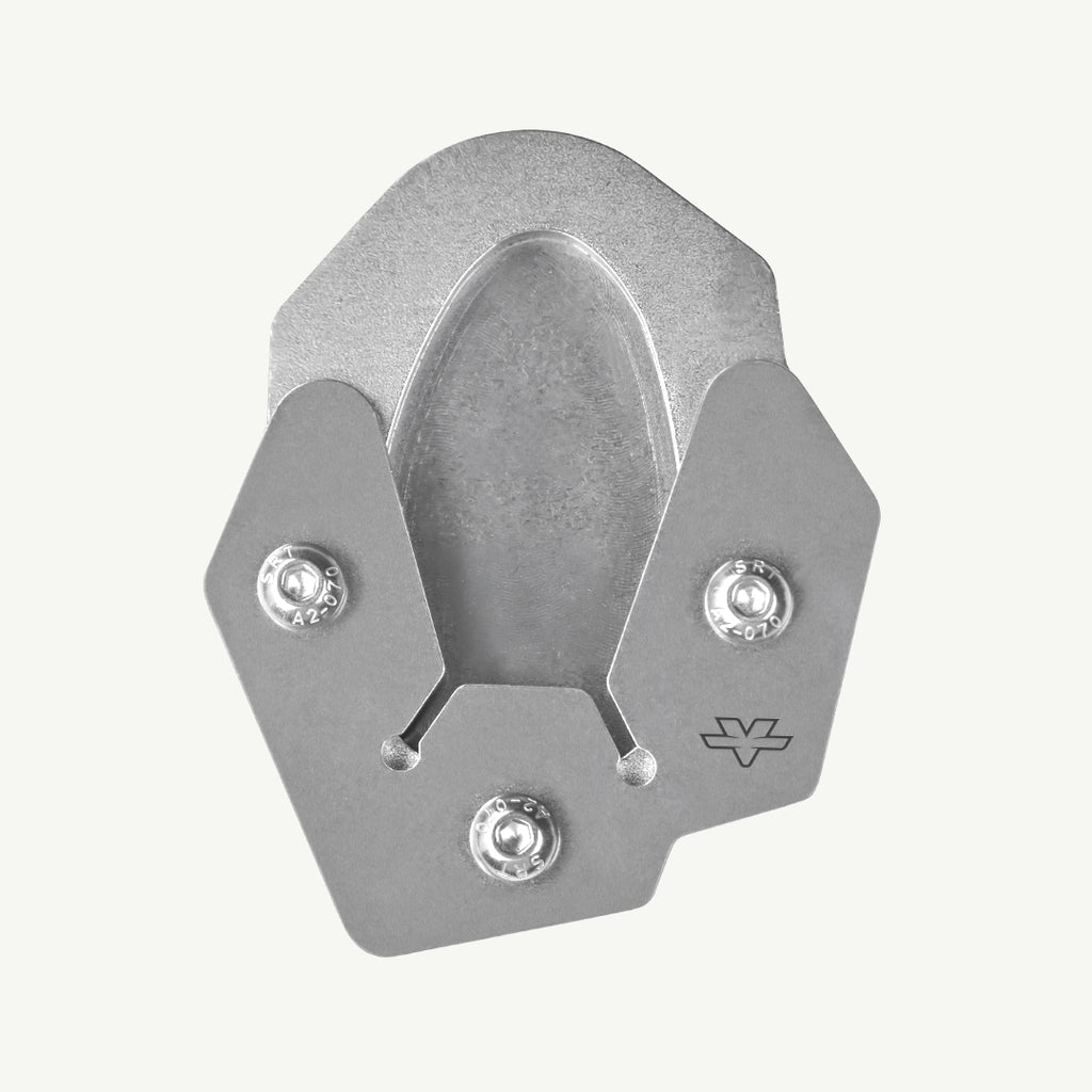 A metallic gray aluminum climbing hook with three silver screws and a small logo engraved on the side, shown on a light off-white background.