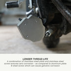 Close-up of a brushed metal motorcycle clutch release bearing assembly with a text overlay at the bottom explaining corrosion benefits.