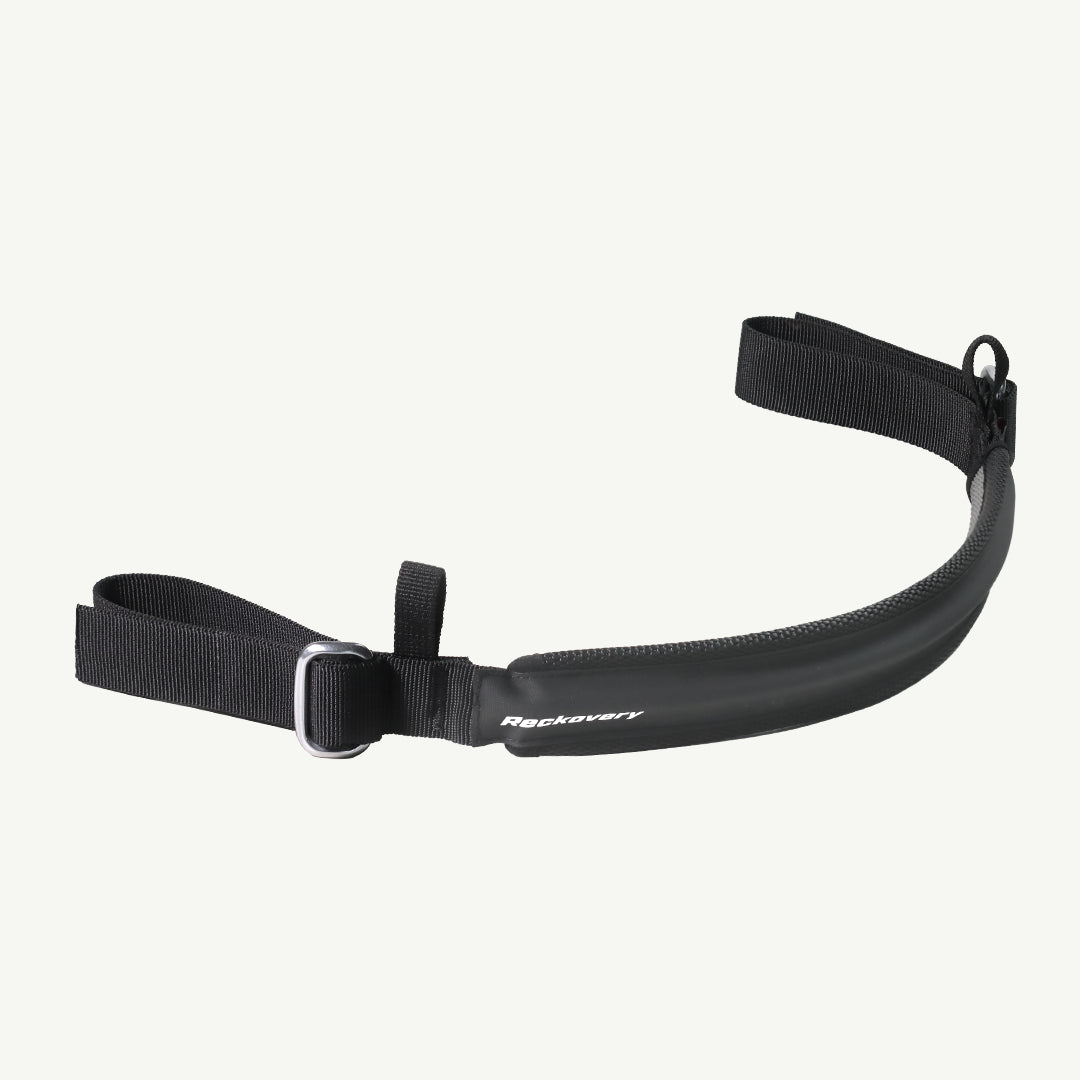 color_black A black recovery belt with a padded center section, adjustable webbing straps, and silver metal buckles, shown against a light off-white background. The brand name 'Recovery' is printed in white on the padded section.