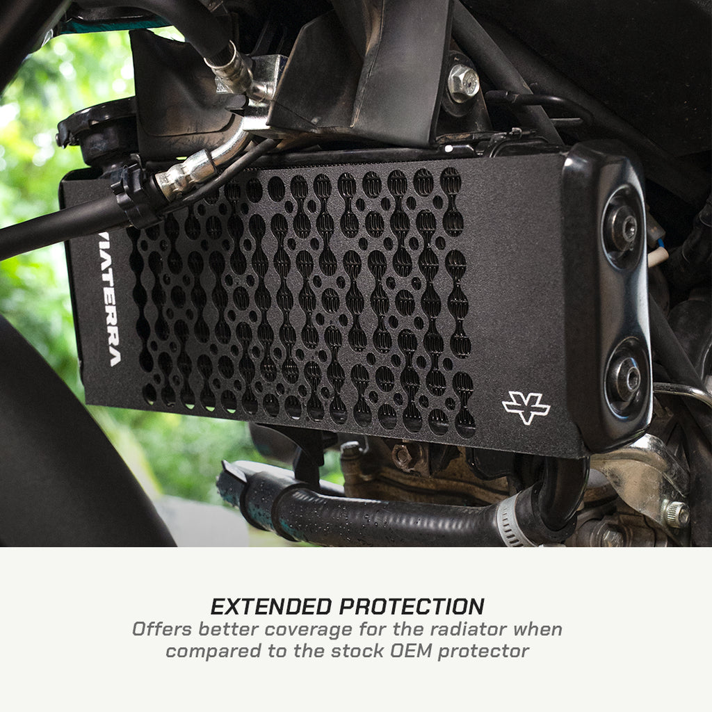 color_black A close-up of a black MATERA radiator protector mounted over a motorcycle radiator, with text below reading 'EXTENDED PROTECTION Offers better coverage for the radiator when compared to the stock OEM protector.'.