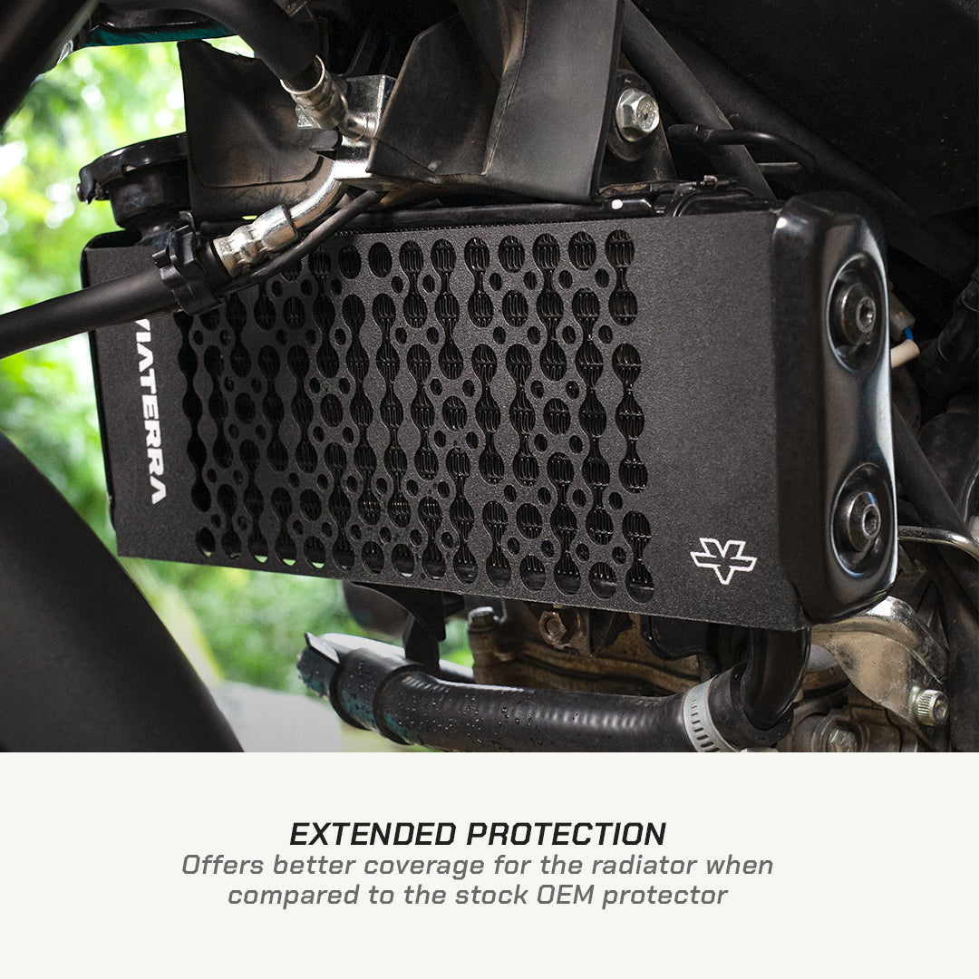 color_black A close-up of a black MATERA radiator protector mounted over a motorcycle radiator, with text below reading 'EXTENDED PROTECTION Offers better coverage for the radiator when compared to the stock OEM protector.'.