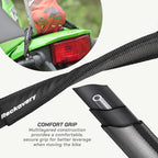 color_black Black Rackovery bicycle handlebar grip strap with a textured grip and adjustable strap, shown with a close-up of the loop holding a metal tube and a circular inset showing the strap attached to a green bike.