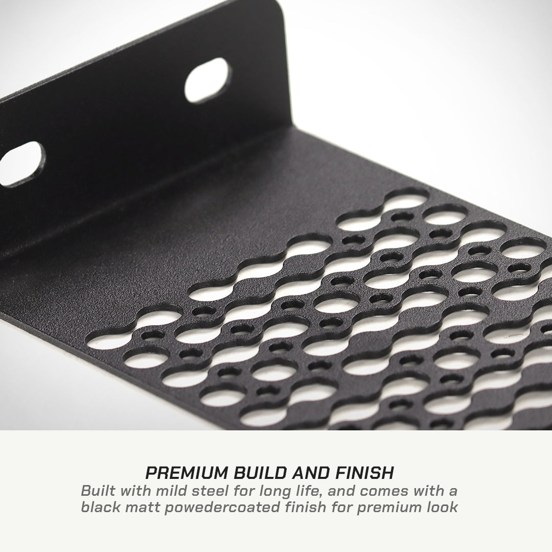 color_black Close-up of a black metal bracket or plate with a perforated cutout pattern and two mounting holes, shown on a white background with text below reading 'PREMIUM BUILD AND FINISH'.