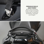 color_black Close-up detail shot of a motorcycle or bicycle seat belt buckle assembly with text on the right reading 'PREMIUM BUILD AND FINISH' and 'Built with stainless steel & high-strength materials to balance durability, strength and weight.'.