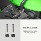 color_black A close-up of gloved hands installing a black strap onto a bright green machine component, with two silver mounting screws and two black rubber pads shown below on a light gray panel. Text reads 'PLUG & PLAY DESIGN' and mentions fitting the Kawasaki KLX 230 using OEM fasteners.