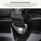 color_black Close-up of a black webbing strap attached to a laser-cut stainless steel bracket on a glossy black surface, with text at the top reading 'PRECISION AND CONSISTENCY'.