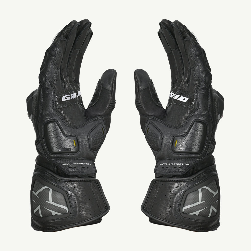 color_common Pair of black motorcycle gloves with brand logo on a white background