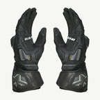 color_common Pair of black motorcycle gloves with brand logo on a white background