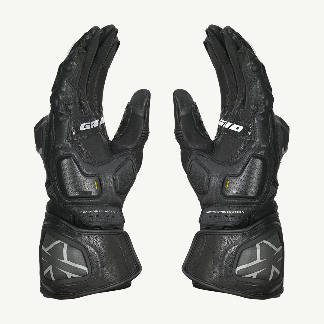 color_common Pair of black motorcycle gloves with brand logo on a white background
