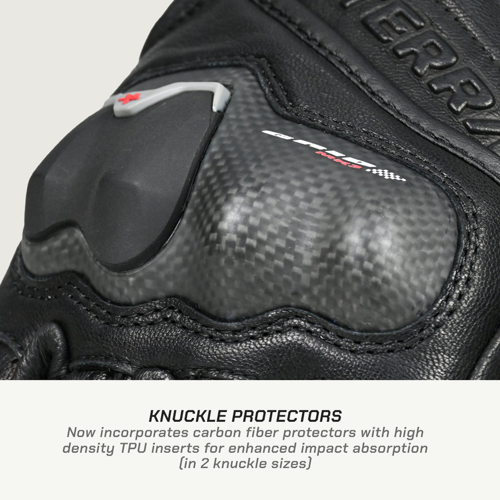 color_common Close-up of a black motorcycle glove with knuckle protectors on a light gray background