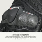 color_common Close-up of a black motorcycle glove with knuckle protectors on a light gray background