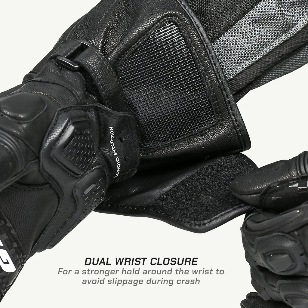 color_common Close-up of a black motorcycle glove with dual wrist closure feature on a white background