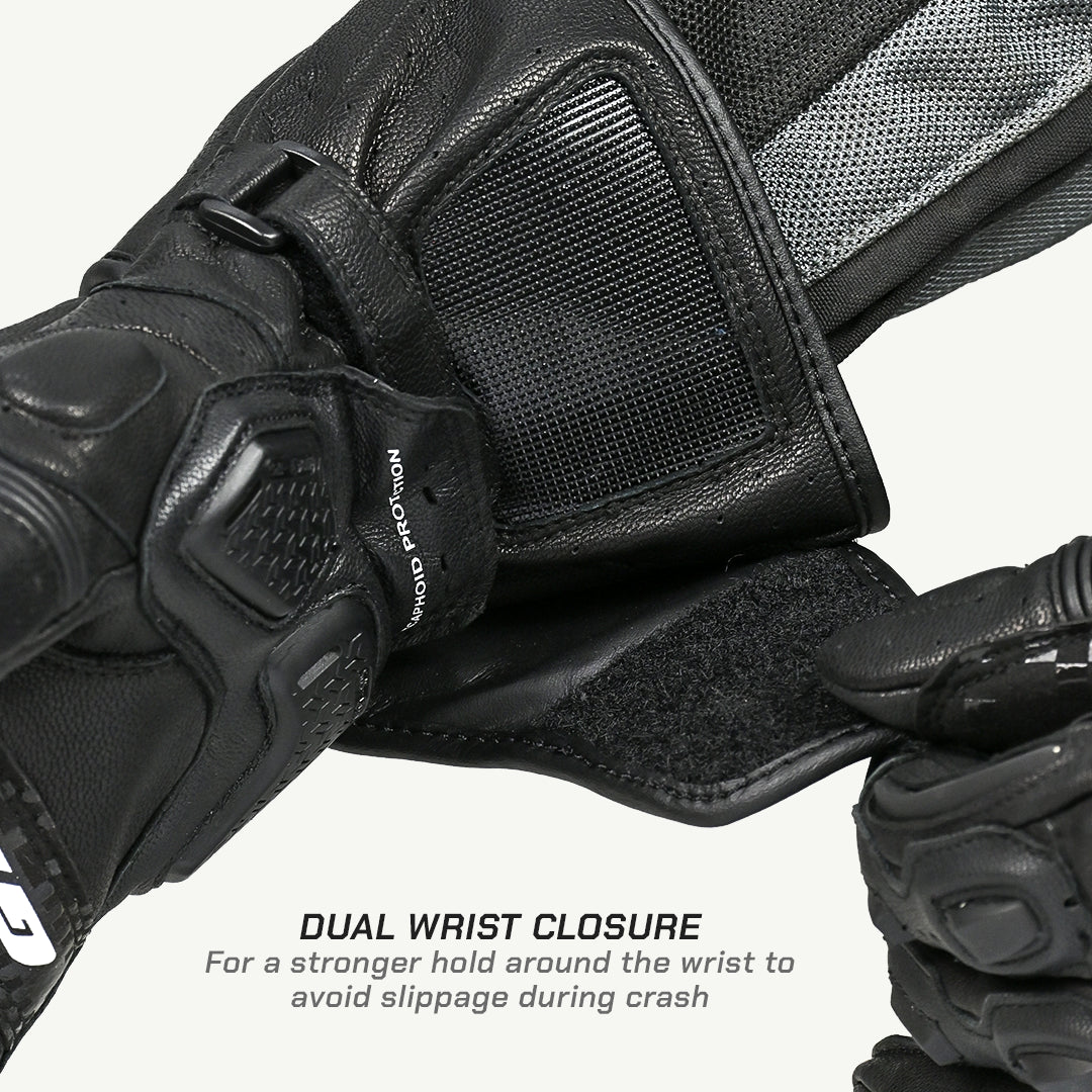 color_common Close-up of a black motorcycle glove with dual wrist closure feature on a white background