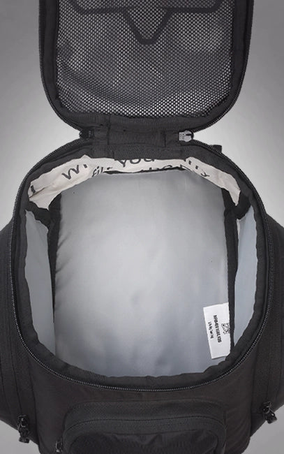 High-Visibility Liner Black backpack interior with gray lining and visible brand label on a gray background