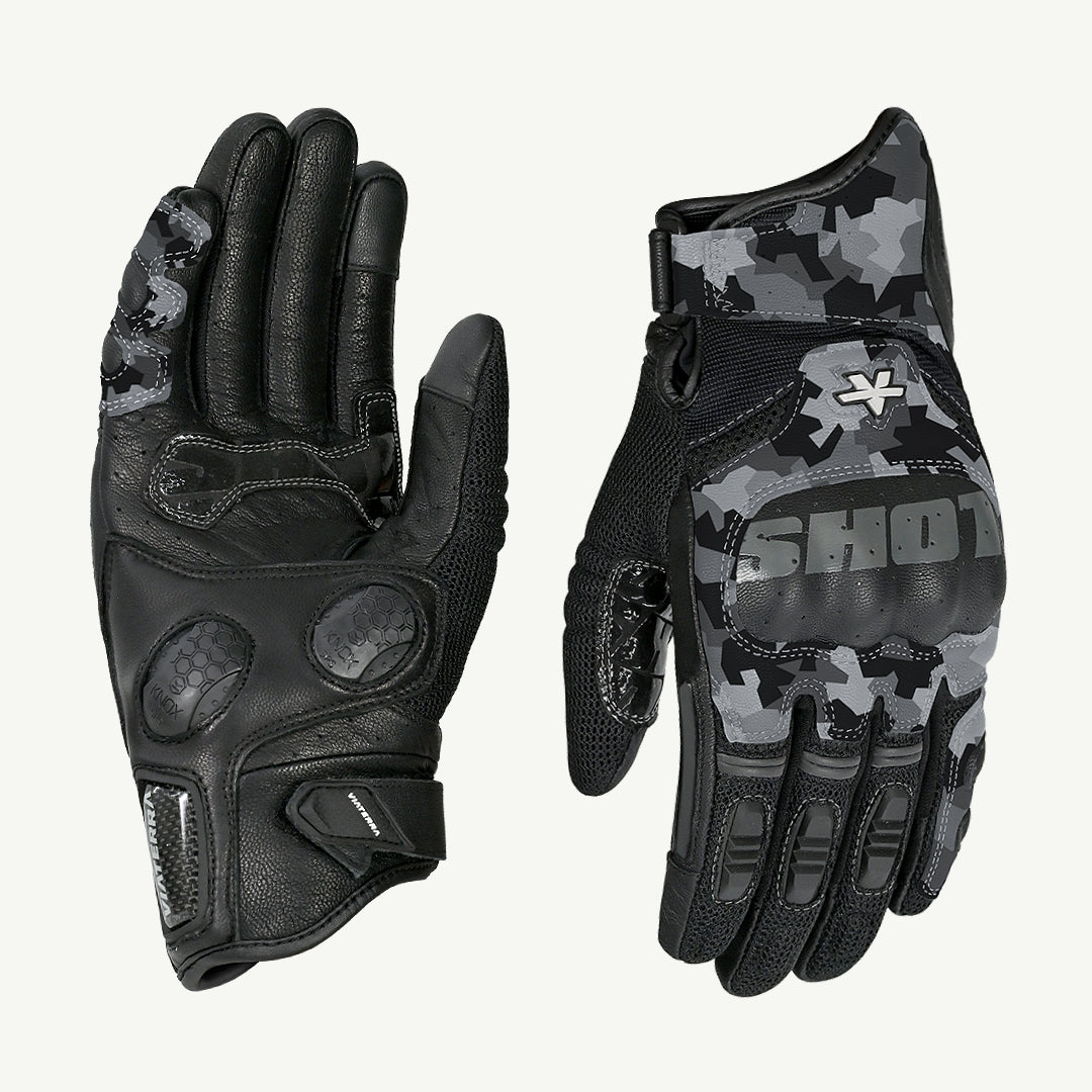 color_snow-camo Pair of black and gray camouflage gloves with a brand logo on a white background