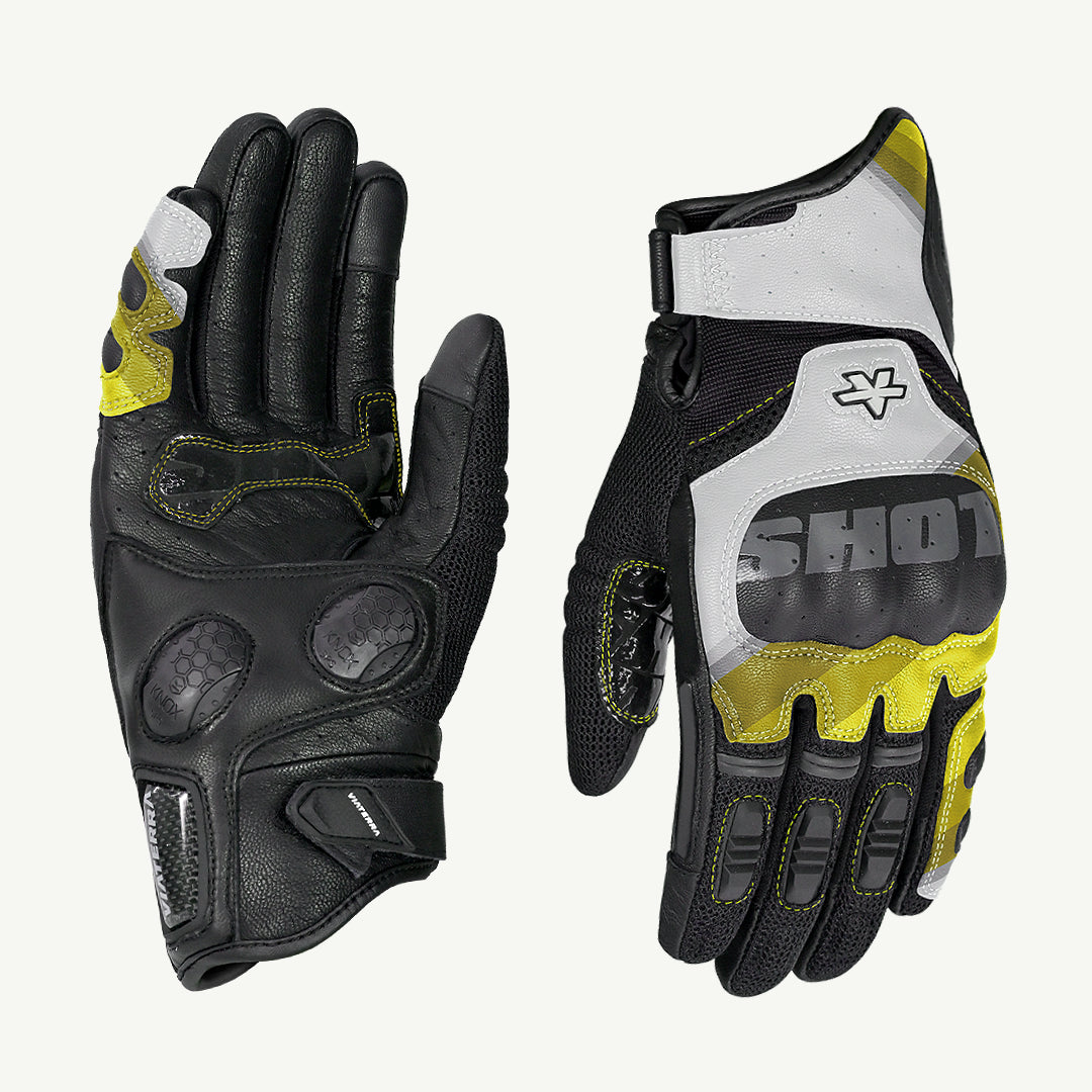 color_yellow Pair of black, gray, and yellow gloves with 'Shox' branding on a white background