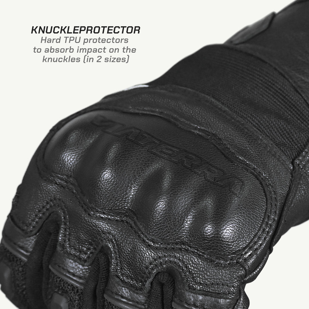 color_common Close-up of a black leather glove with knuckle protector on a white background