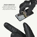 color_common Black gloves with touch-sensitive leather panels on index and thumb tips, used to operate a smartphone.