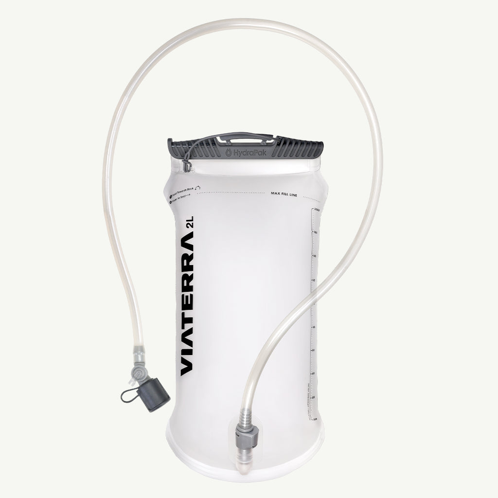VIATERRA HYDRAPAK ELITE 2L BLADDER  A 2-liter Viaterra water bladder in white with a black top cap and clear drinking tube, shown against a light off-white background.