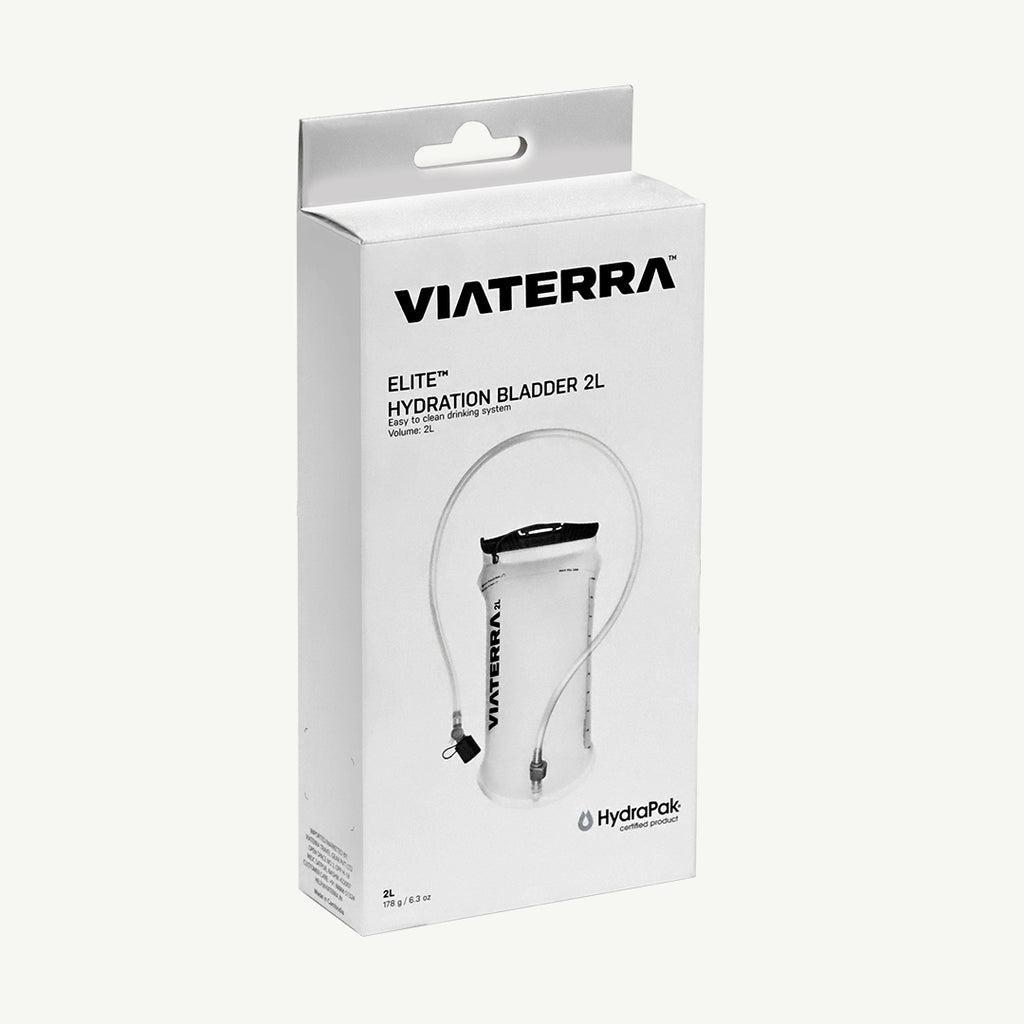 Viaterra Elite Hydration Bladder 2L in its original white retail packaging, featuring a clear bladder with a black neck cap and attached tubing, shown against a light off-white background.
