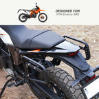 Saddlebag Rack - KTM Enduro 390 Close-up of a motorcycle with text 'Designed for KTM Enduro 390' on a white background.