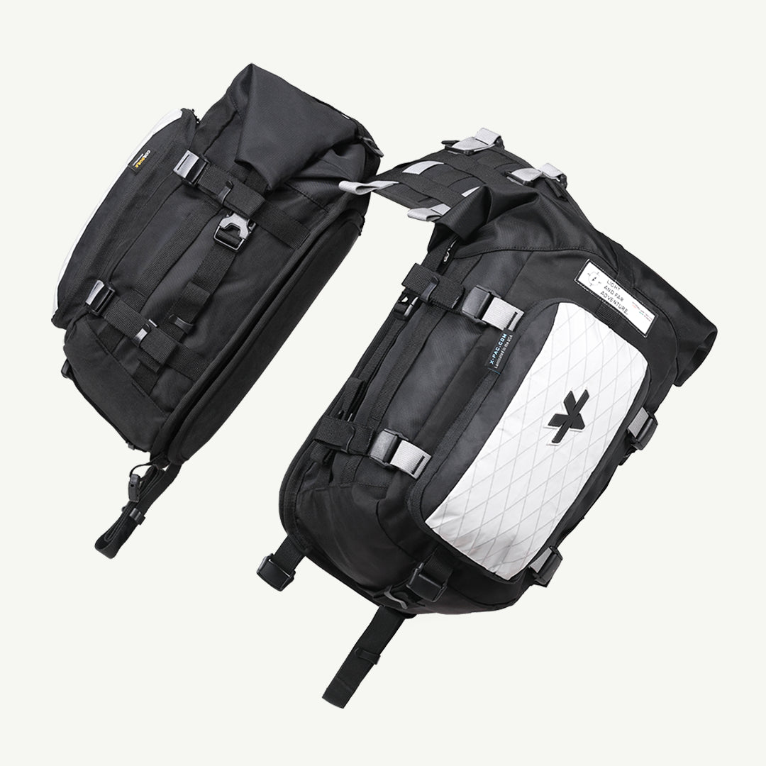 LFA-SaddleBag Two black backpacks with a visible brand logo on a white background