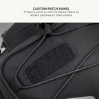 LFA - Tank Bag - Enduro Black backpack with a Velcro patch panel on a gray background