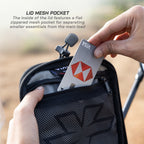 LFA - Tank Bag - XC Person opening a black mesh pocket with a card inside, featuring text about the lid mesh pocket.