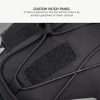 LFA - Tank Bag - XC Black backpack with a Velcro patch panel on a gray background