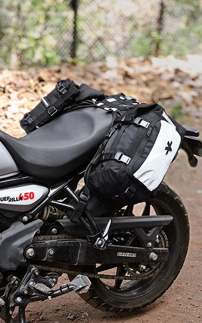 MOLLE Utility Loops Motorcycle with saddlebags and gear on a dirt path