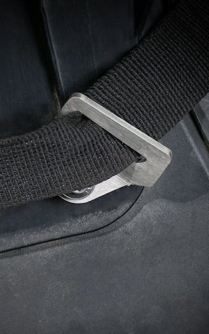 Optional Rear Mounting Close-up of a black seat belt buckle on a car seat.