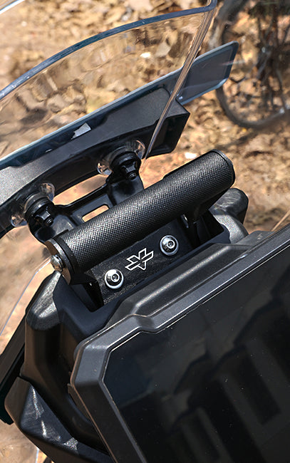 Precision & Consistency Close-up of a motorcycle handlebar with a windshield on a natural background