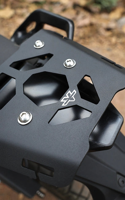 Premium build and finish Close-up of a black metal bracket with a brand logo on a blurred natural background