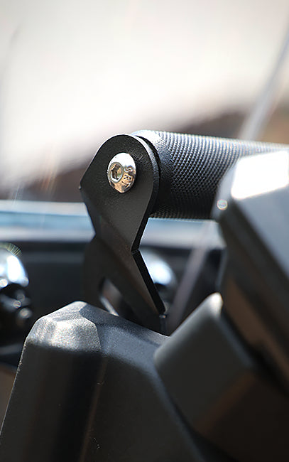 Premium build and finish Close-up of a black metal bracket with a screw on a blurred background