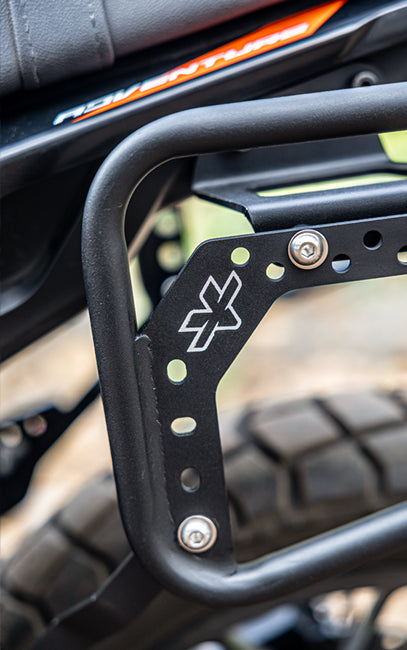 Premium build and finish Close-up of a black metal rack with a logo on a vehicle, blurred background