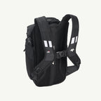 Black backpack shown from the back, featuring a breathable mesh back panel, padded shoulder straps with white reflective stripes, and a quick-release buckle closure, set against a plain off-white background.