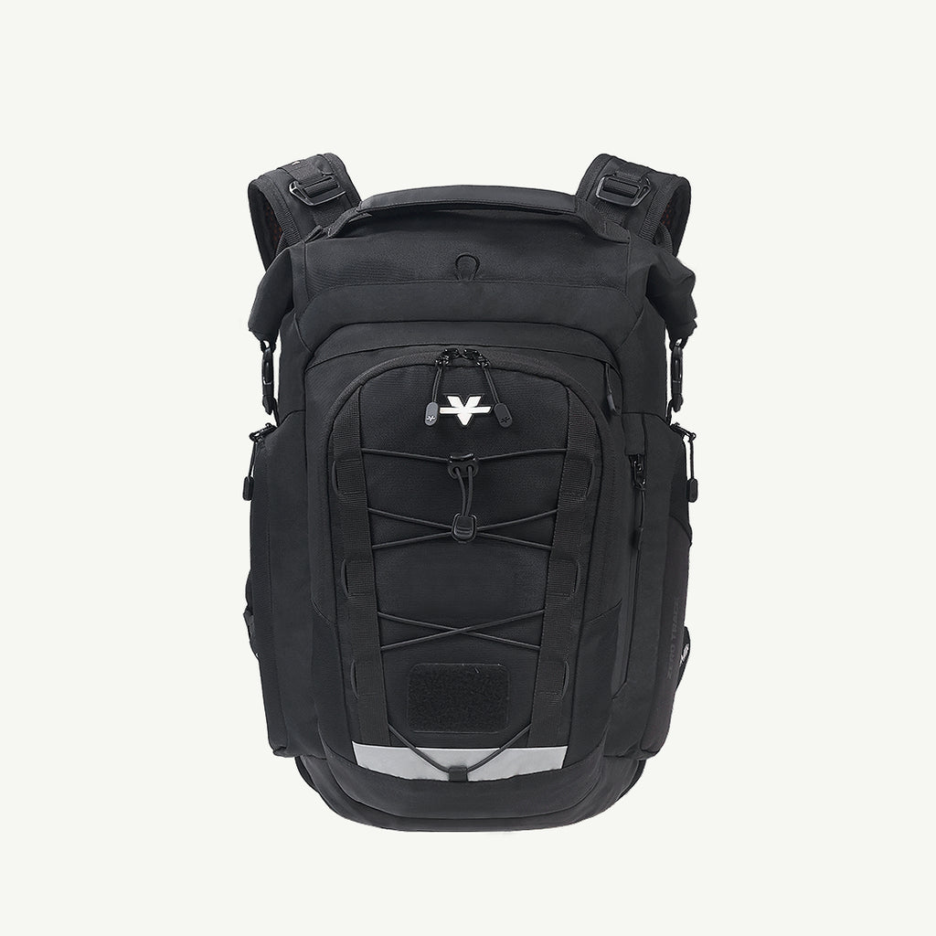 A black backpack with multiple zippered compartments, compression straps, and a white stylized logo on the front, shown against a plain off-white background.