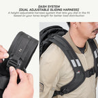 A promotional product image for a black Piquadro dash system dual adjustable sliding harness. The left panel shows a close-up of hands adjusting the black plastic buckle on the harness strap, with explanatory text at the top.