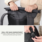 Close-up of a black backpack with a roll-top main compartment being opened by a person's hands, plus a smaller inset showing the buckle detail and text describing the roll-top compartment.