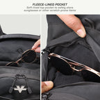 Close-up of a black backpack pocket with fleece lining, showing sunglasses being stored inside. The image includes text at the top reading 'FLEECE-LINED POCKET' and two side panels demonstrating the pocket's use, with a hand opening the zipper and placing sunglasses inside.
