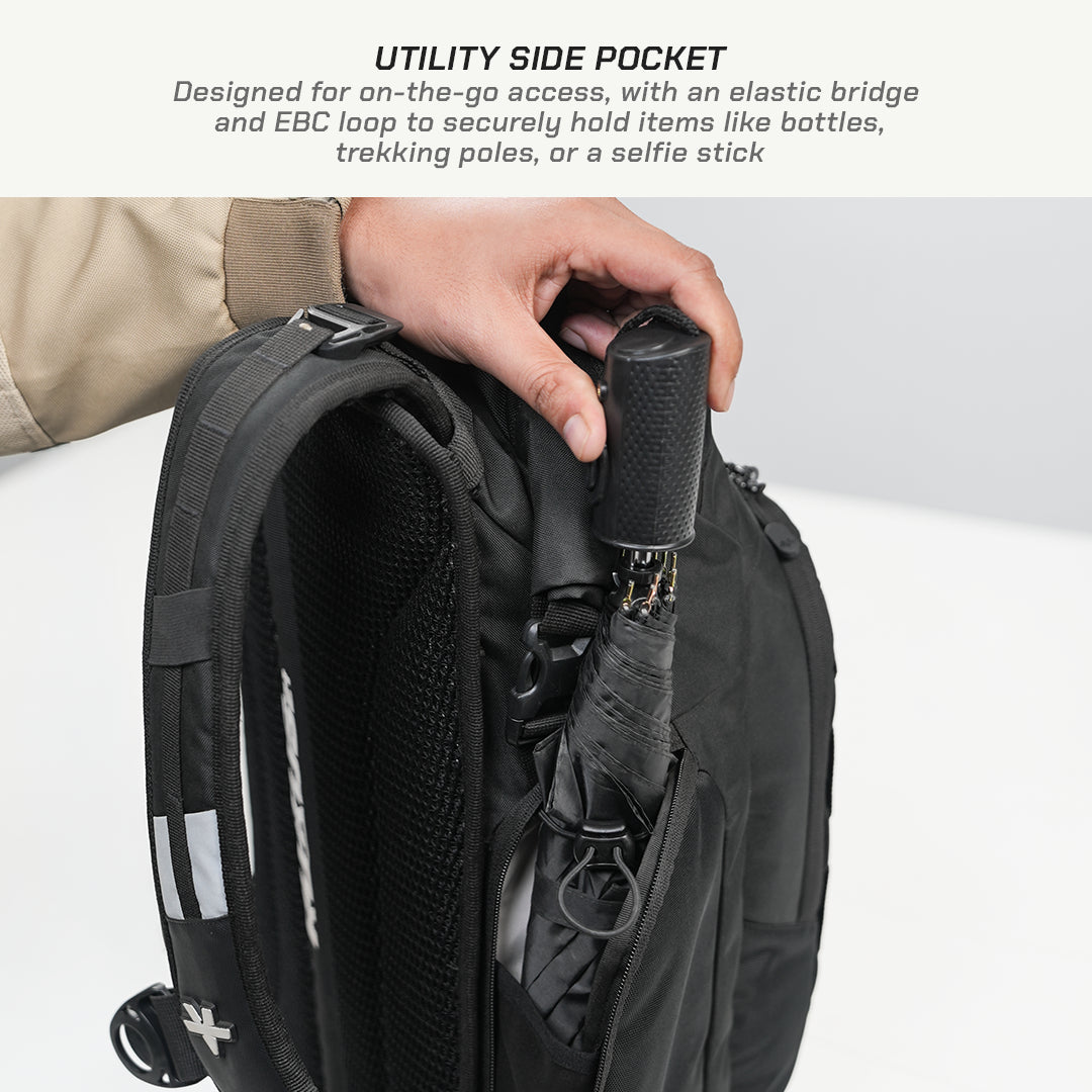 Close-up of a black backpack with a hand inserting a black umbrella into a utility side pocket, with explanatory text at the top about the side pocket design.