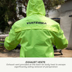 color_Fluoroscent-Green Person wearing a bright green jacket with 'VIATERRA' branding, showing exhaust vents on the back.