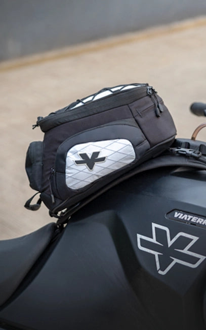 Reinforced Structured Body Black motorcycle saddlebag with a brand logo on a motorcycle.