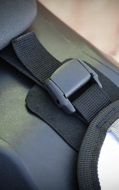 Surface Protection Interface Close-up of a black car seat belt buckle and strap.