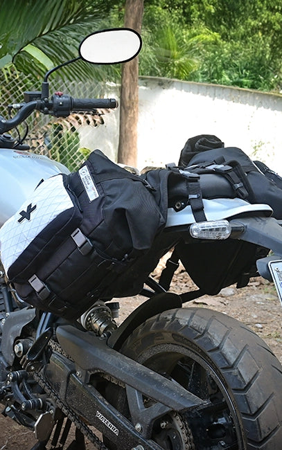 Triangular 3-Point Mount Close-up of a motorcycle with black saddlebags and visible branding.